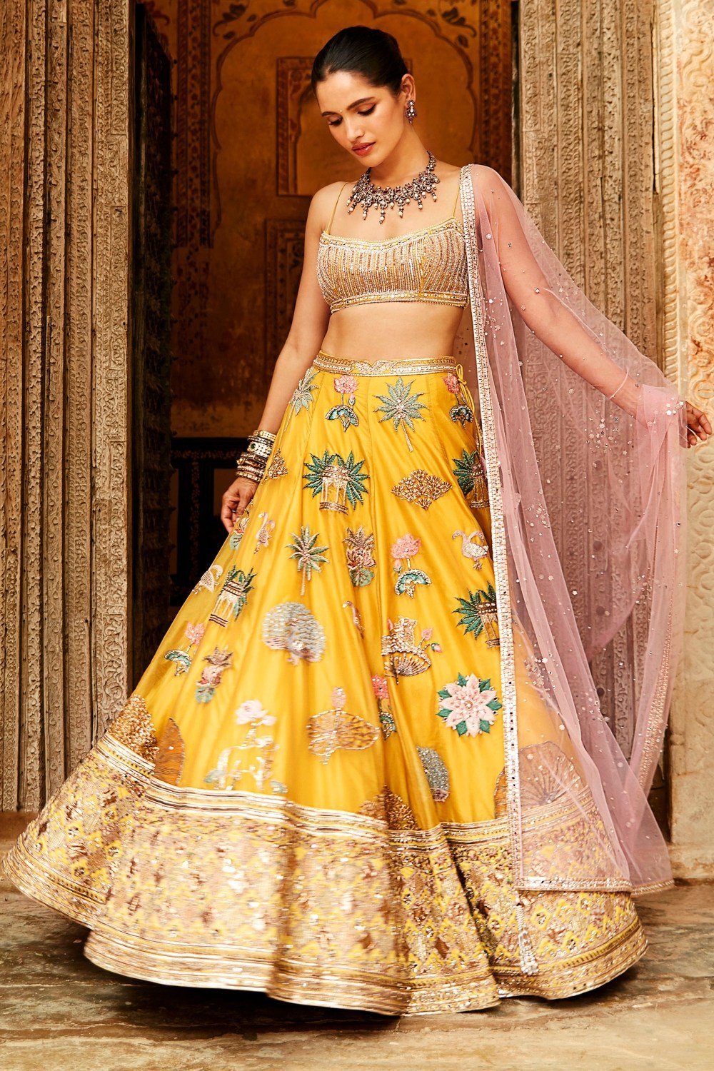 designer lehenga choli for haldi function for bride