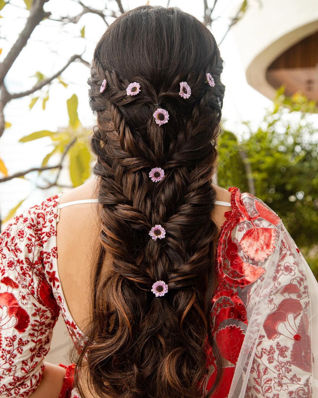 quirky and messy braided reception hairstyle for lehenga