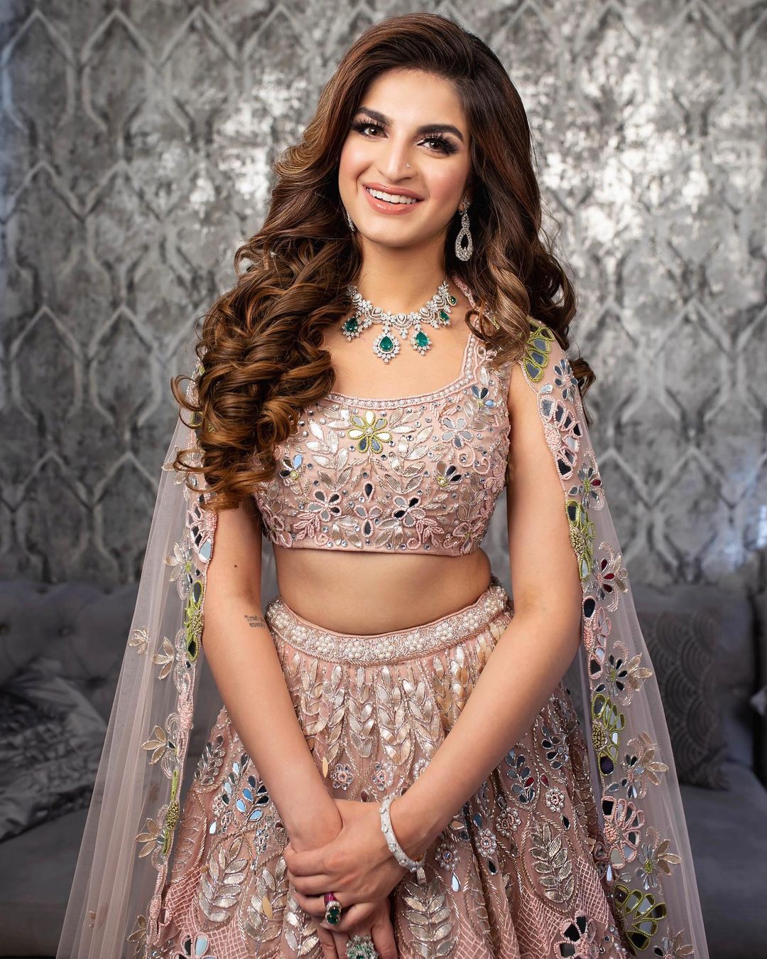 voluminous curls hairstyle with lehenga