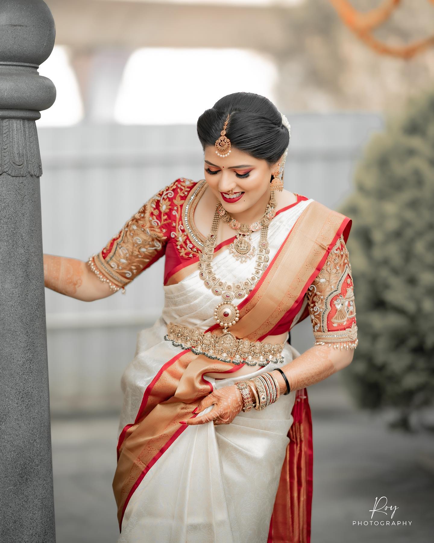 bride in red and white kanjeevaram silk saree