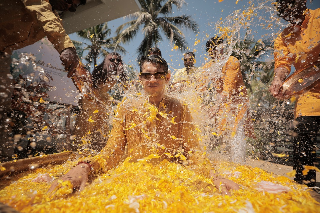Aseem drenched in water on his haldi by groomsmen 