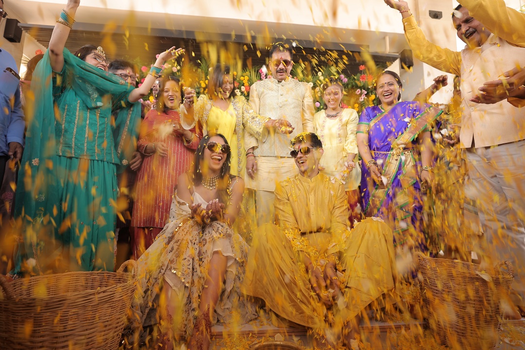 family playing phoolon ki holi with Kashish and Aseem on haldi ceremony