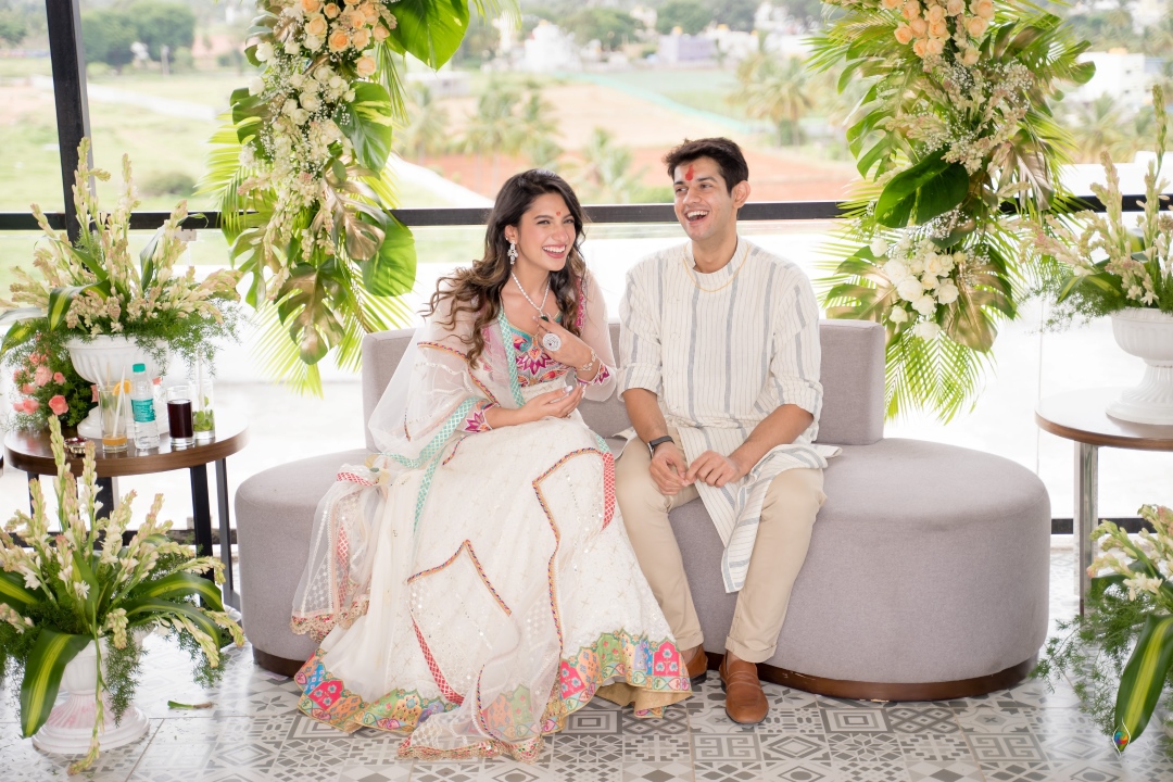 Kashish and Aseem on their roka ceremony in white designer outfits