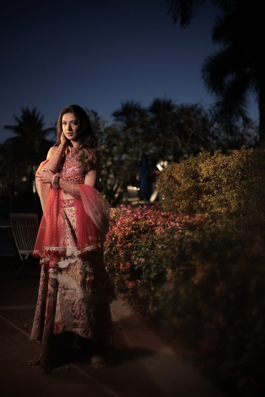 Kashish posing on her mehndi ceremony in Varul Bahl asymmetric floral embroidered lehenga