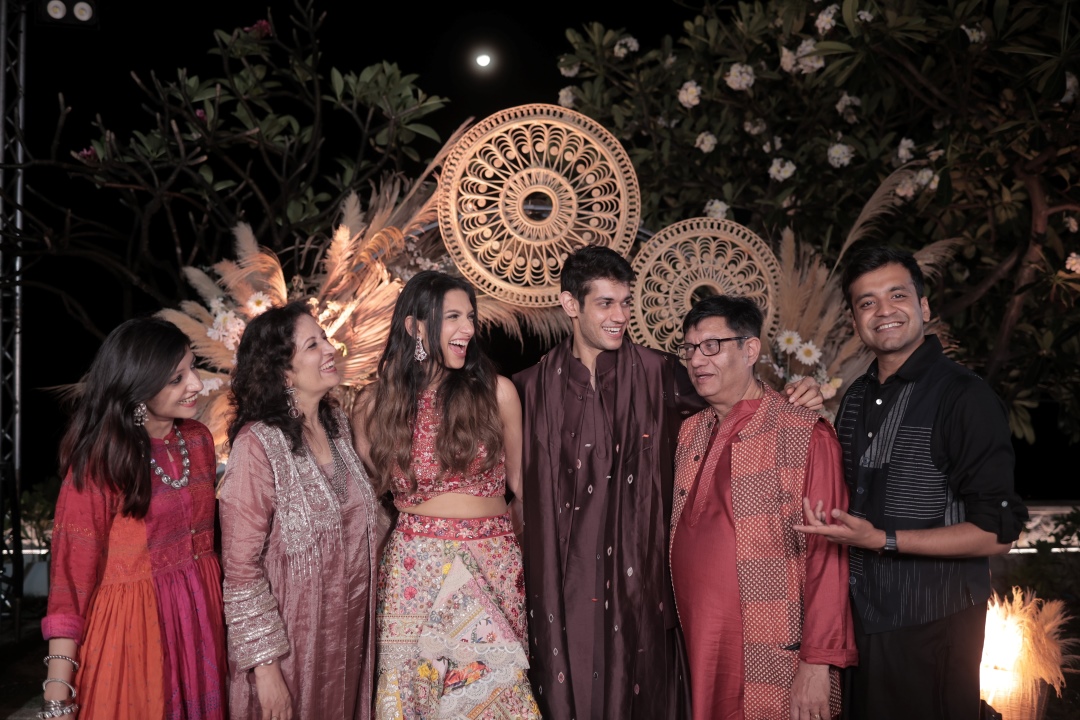 Kashish and Aseem giving a candid shot with family on mehendi ceremony