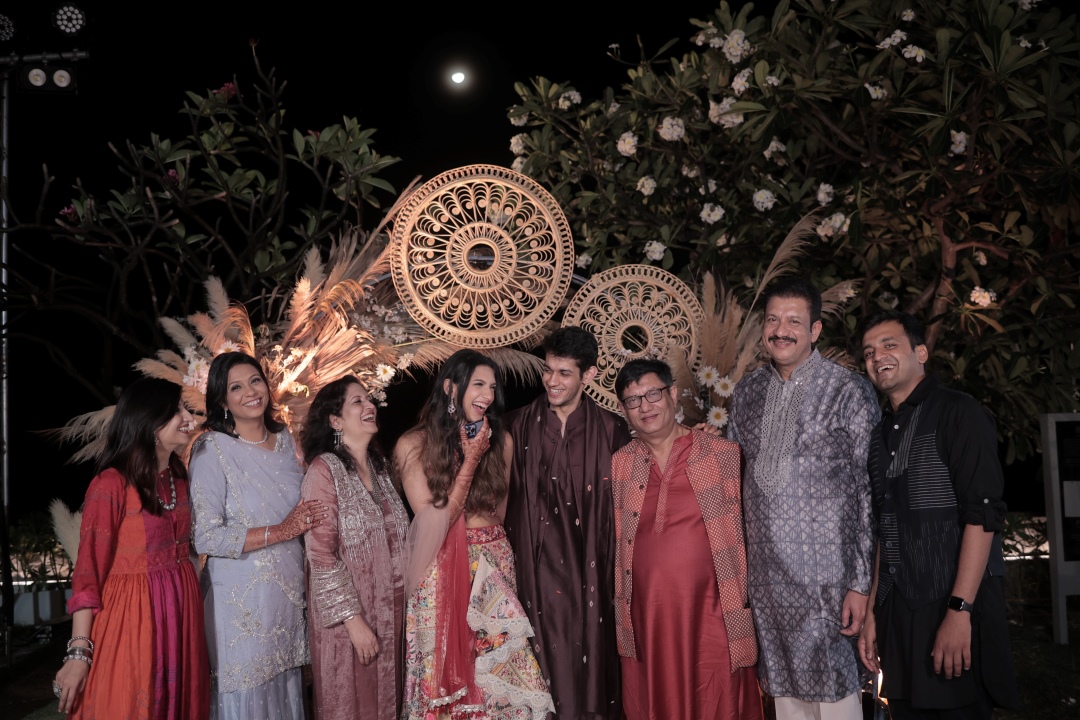 Kashish and Aseem with their family for mehendi photoshoot on stage