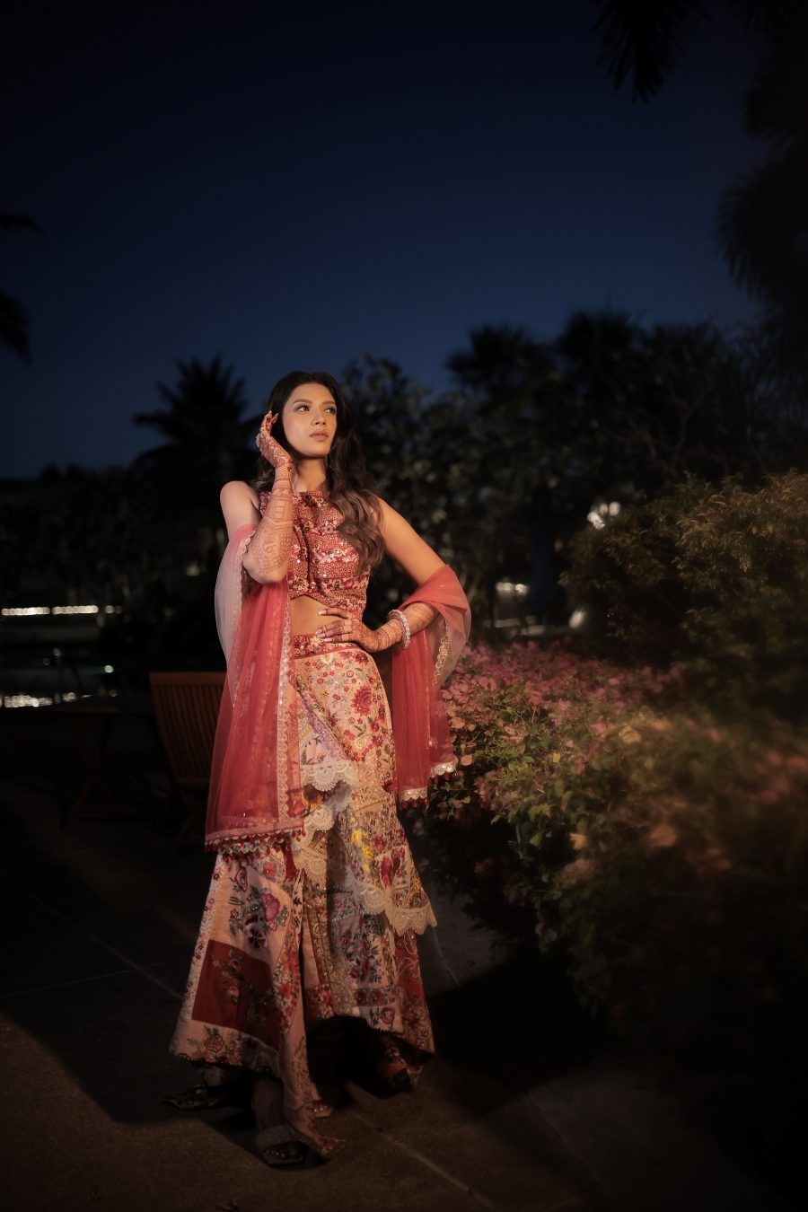 Kashish during her mehendi photoshoot in a multicoloured floral embroidered lehenga 