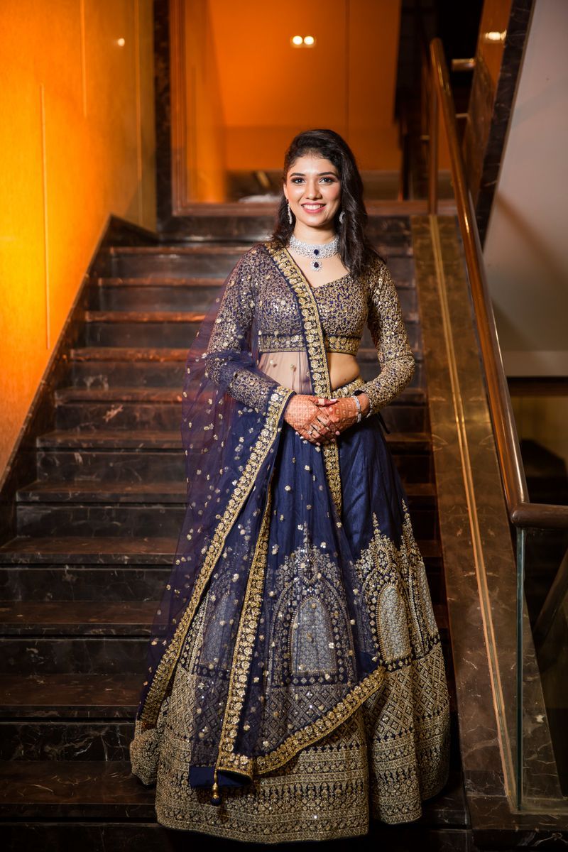 heavy royal golden and blue embroidered lehenga for ring ceremony