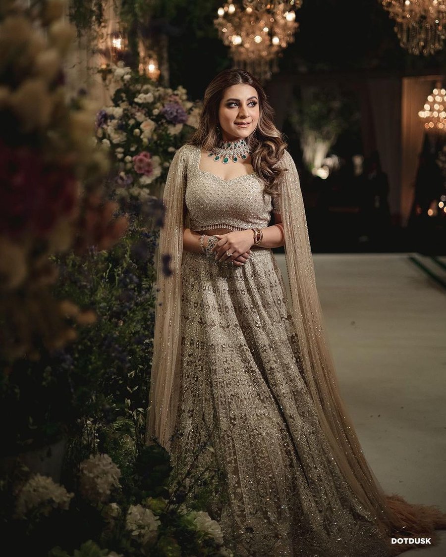 heavy embroidered beige lehenga with cape dupatta