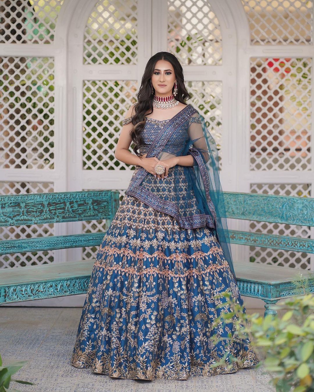 engagement bride in blue lehenga with off shoulder blouse
