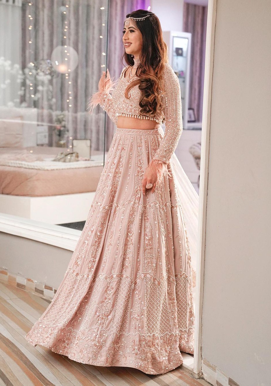 light pastel engagement lehenga with feathers