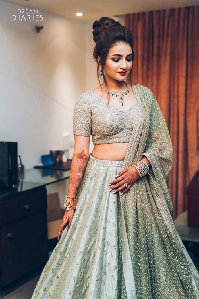 engagement look in pastel green and silver lehenga choli