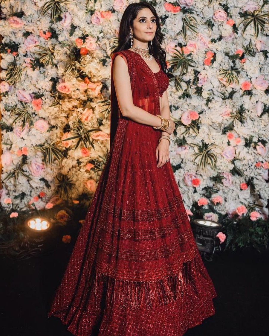 bride in wine red sequin lehenga