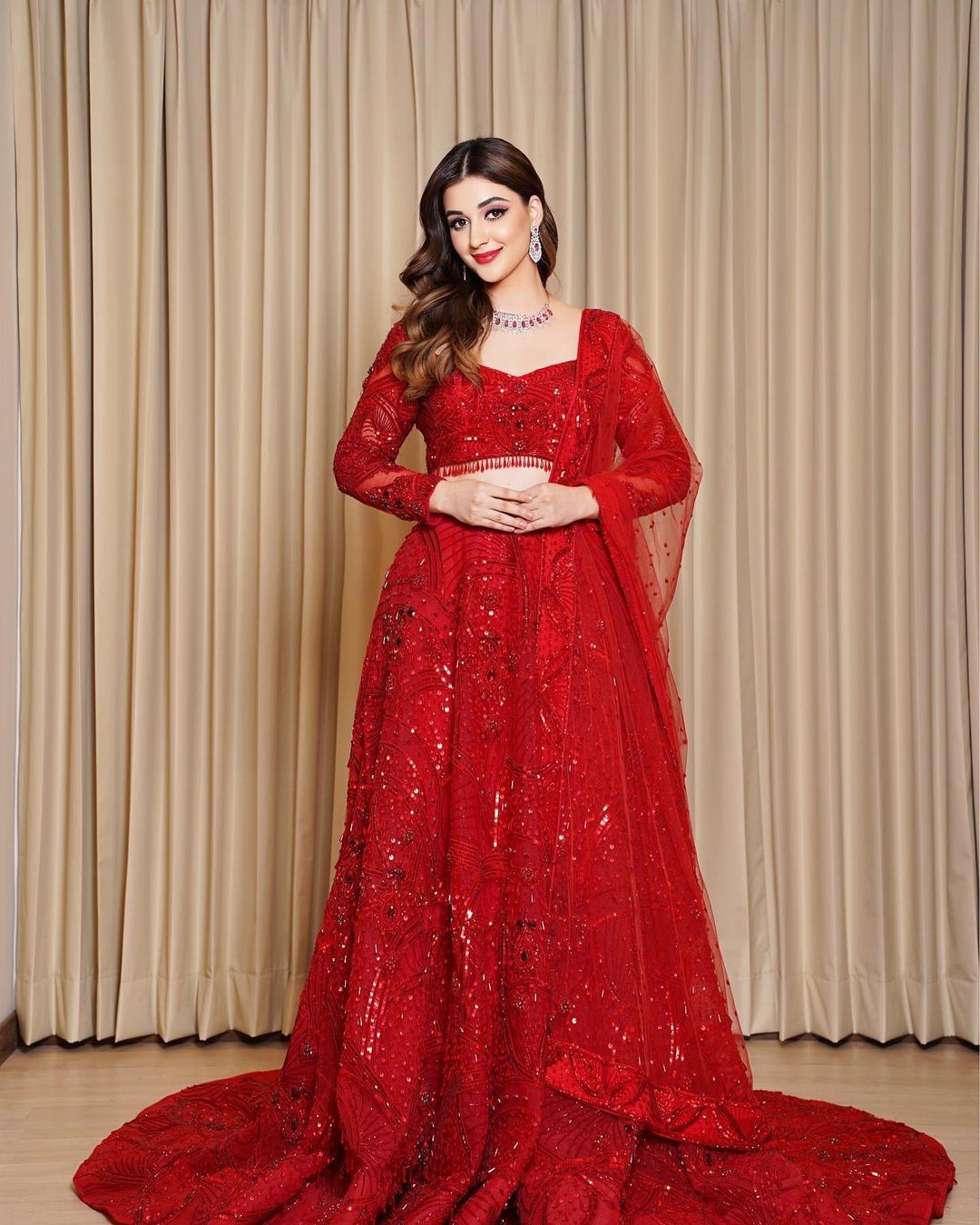 monotone red sequin lehenga with trail 