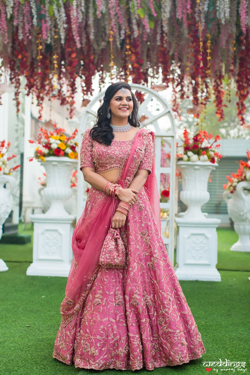 heavy embroidered engagement lehenga for bride in pink and silver
