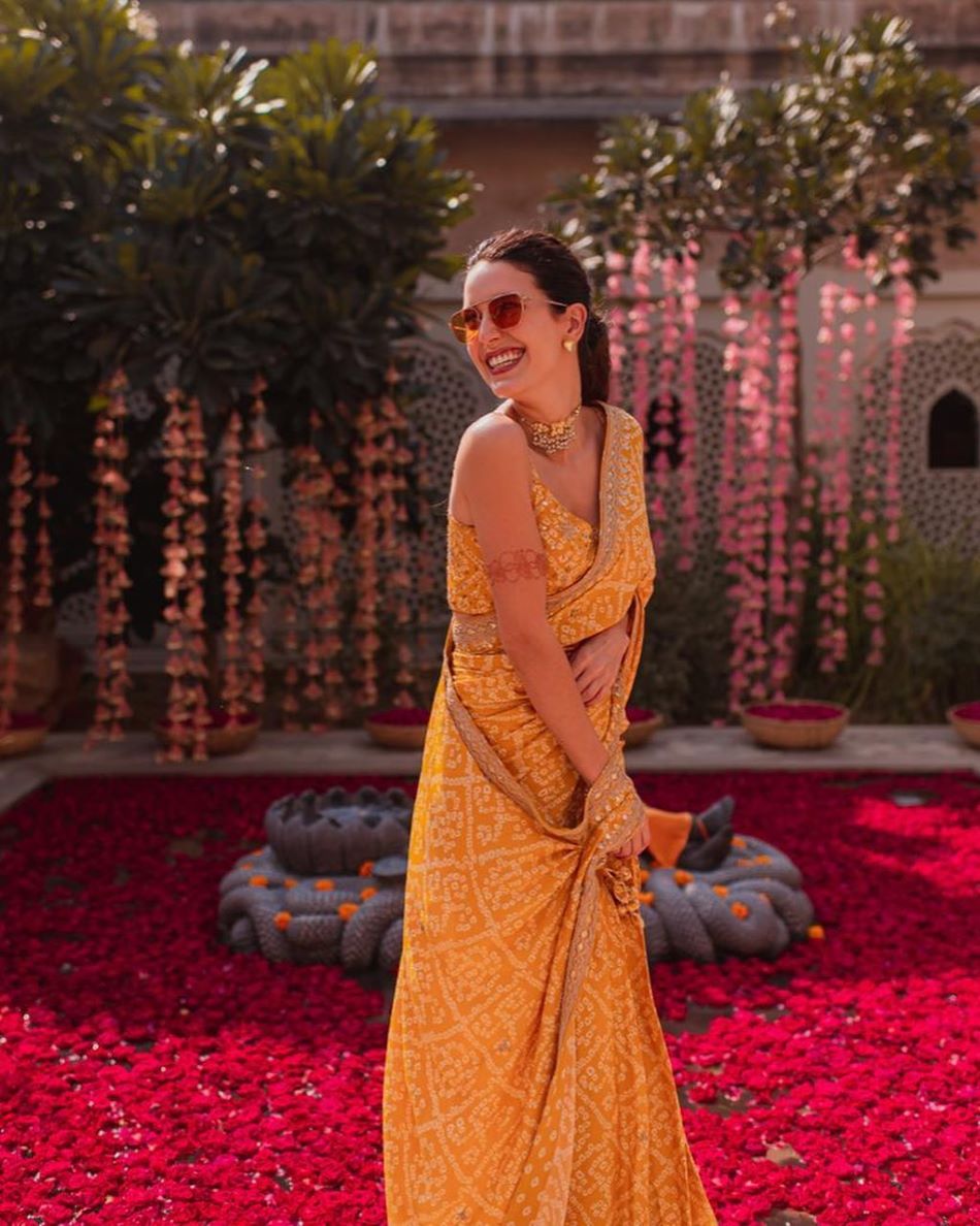 contrast yellow and white bandhani saree for haldi