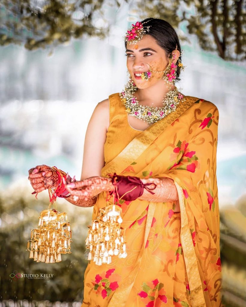 yellow floral haldi ceremony saree