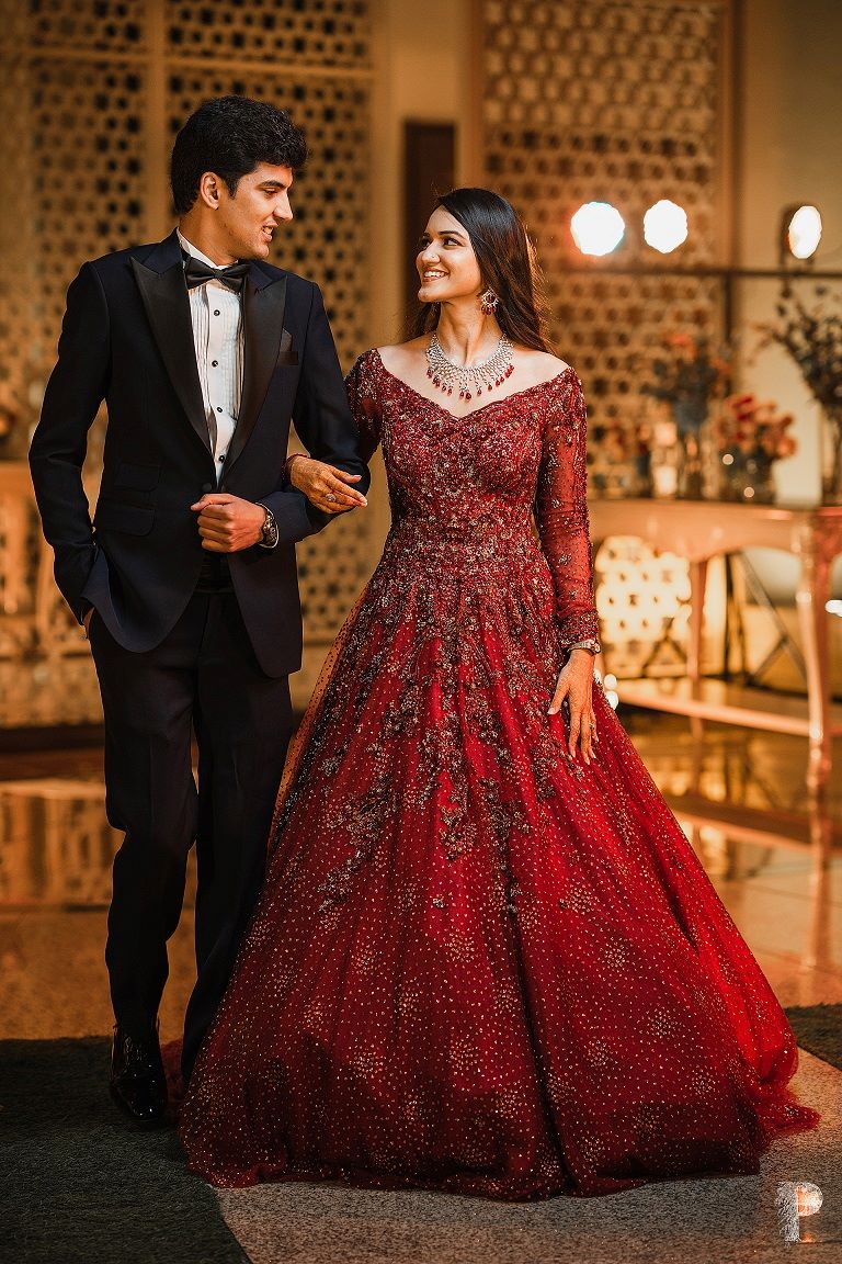 reception bride in red off shoulder long gown