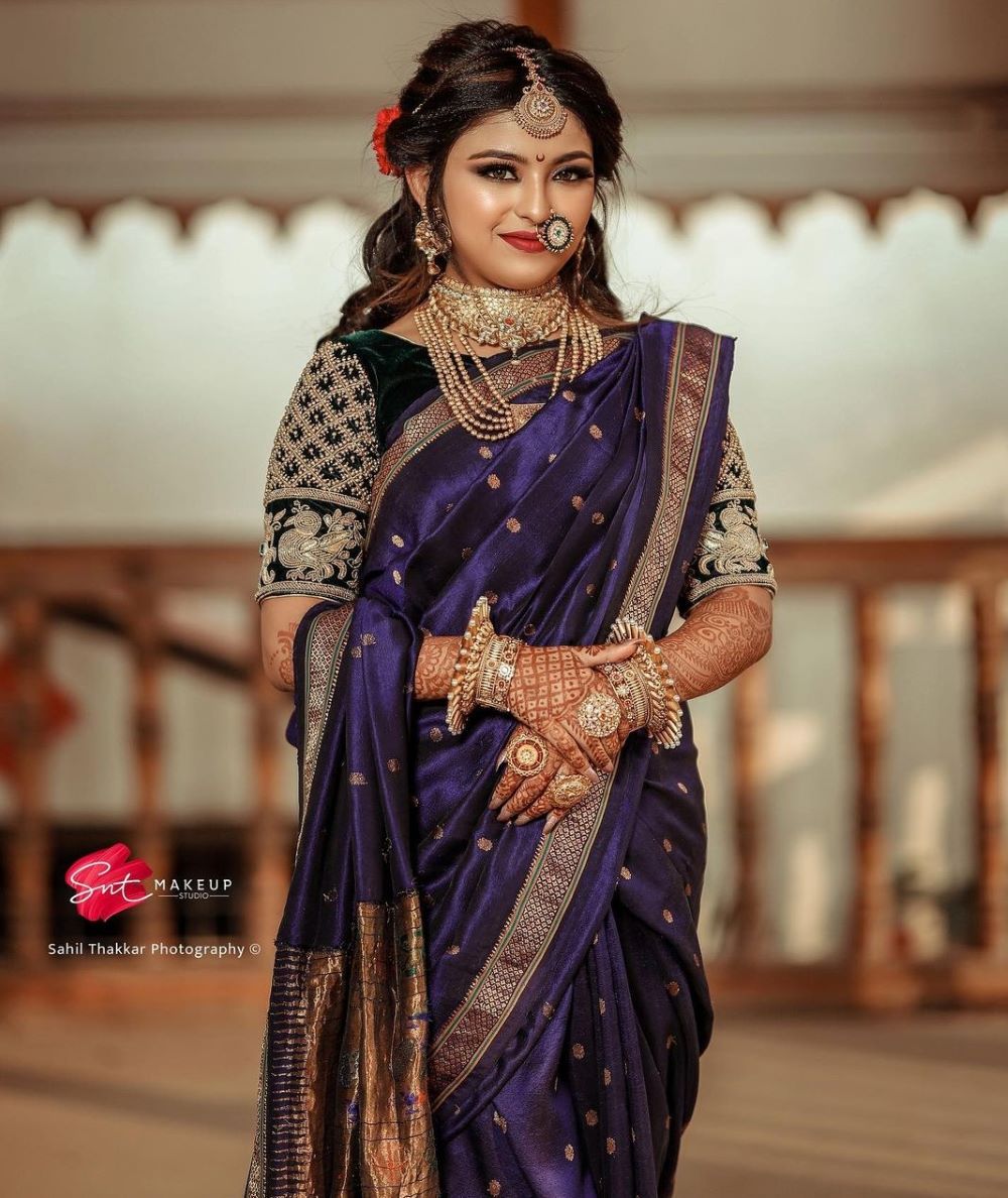 marathi bride in beautiful purple wedding nauvari saree and black blouse