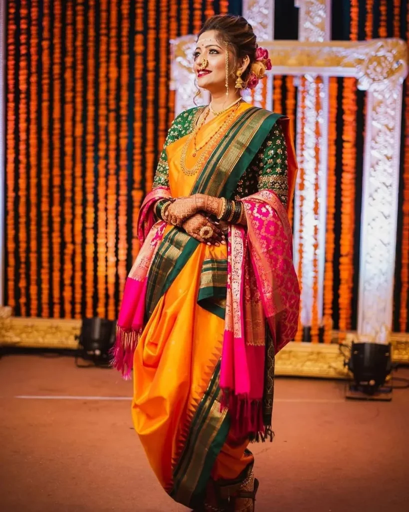 mango yellow wedding nauvari saree with green border and pink shela