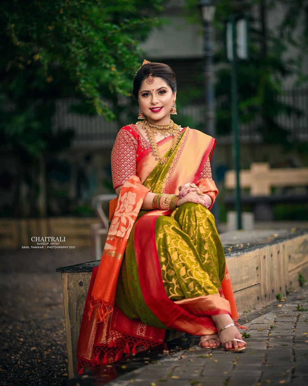 green marathi nauvari saree look with jewellery and contrasting colour shela