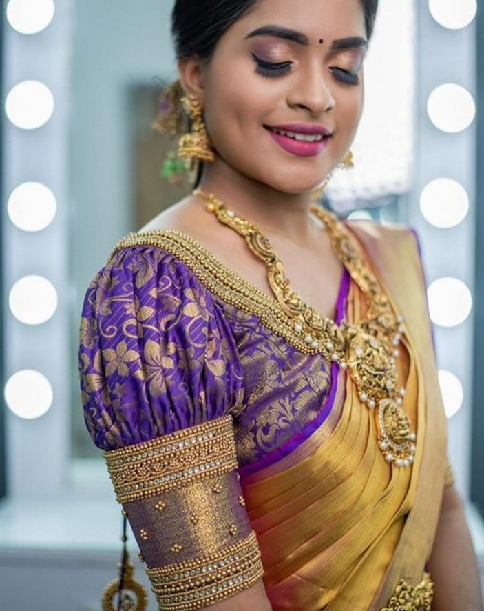 purple south indian wedding blouse with contrasting puff sleeves