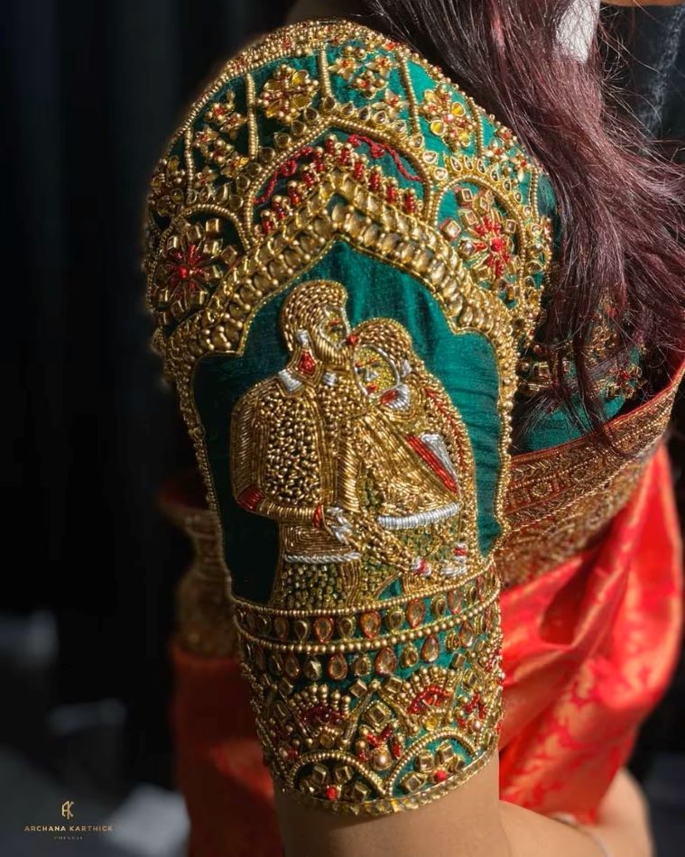 south indian bridal blouse with couple images on sleeves