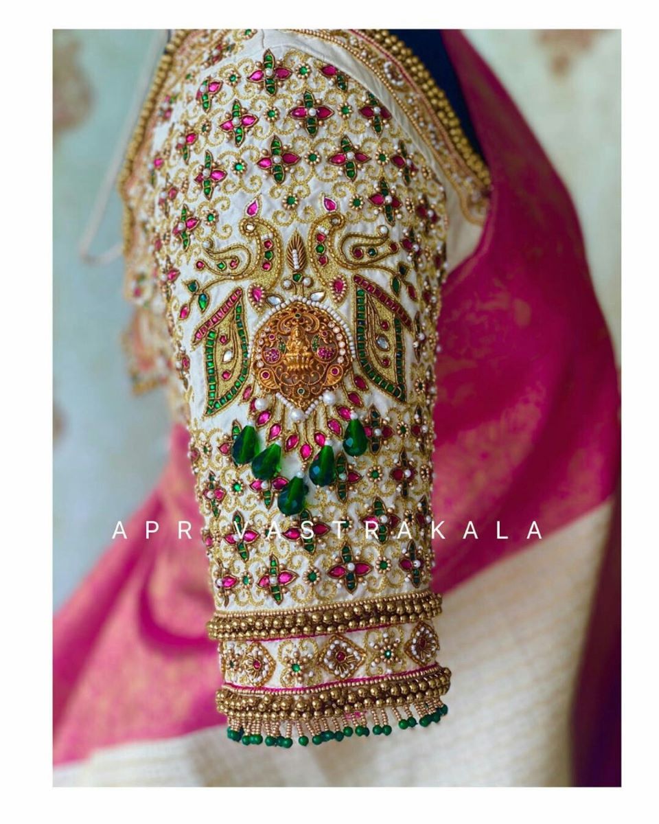south indian bridal blouse sleeve design with temple work pattern 