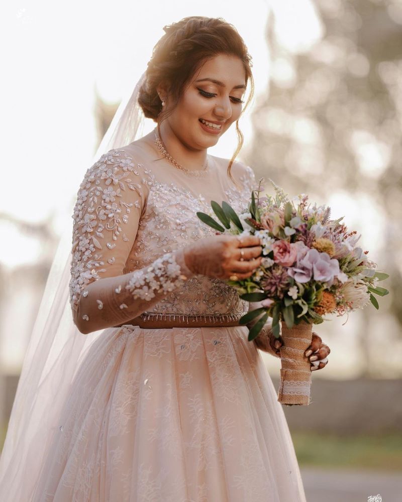christian kerala bride in gown and nude makeup