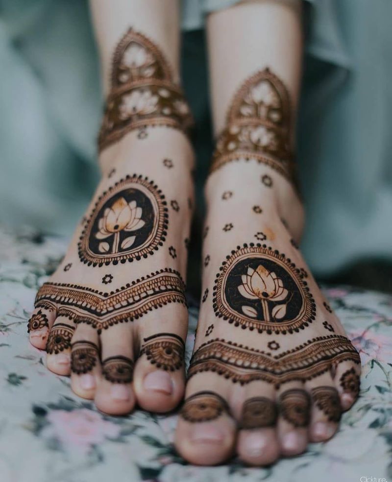 feet mehndi for bride with lotus flower and mandala