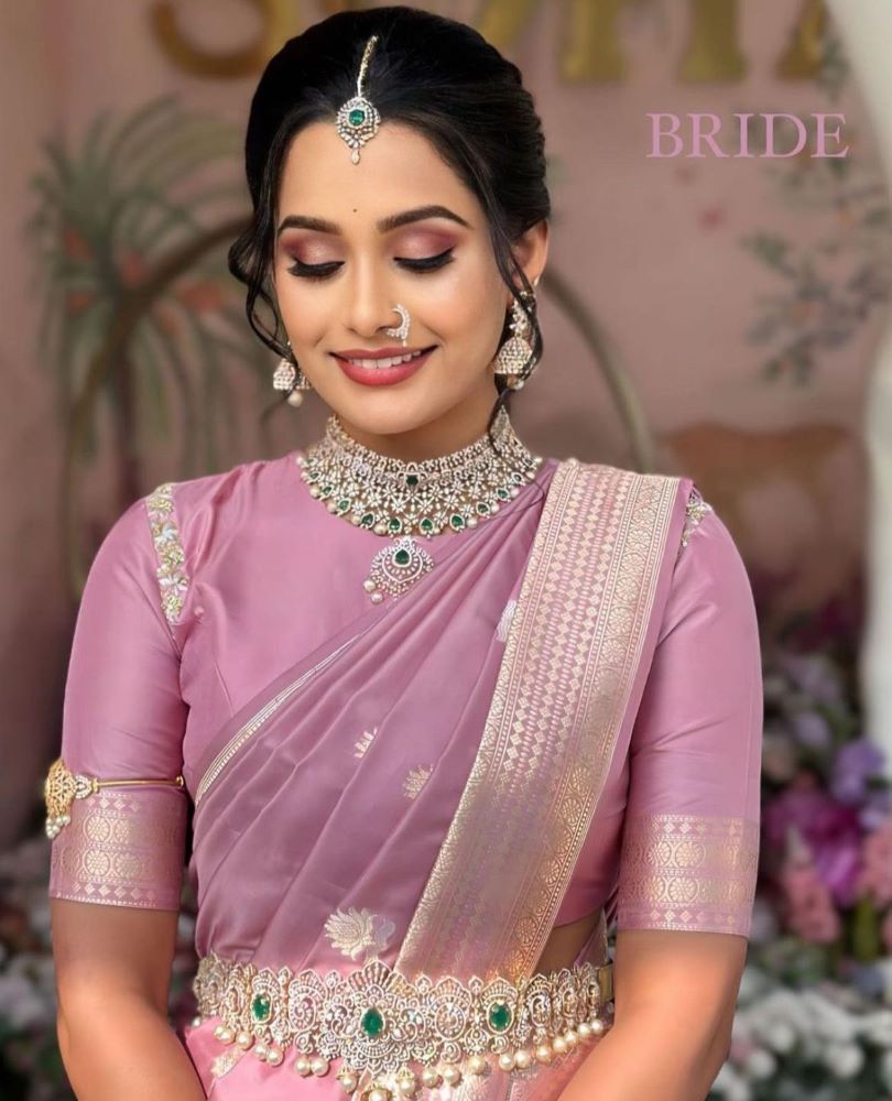 simple kerala bride wearing pink silk saree and diamond jewellery