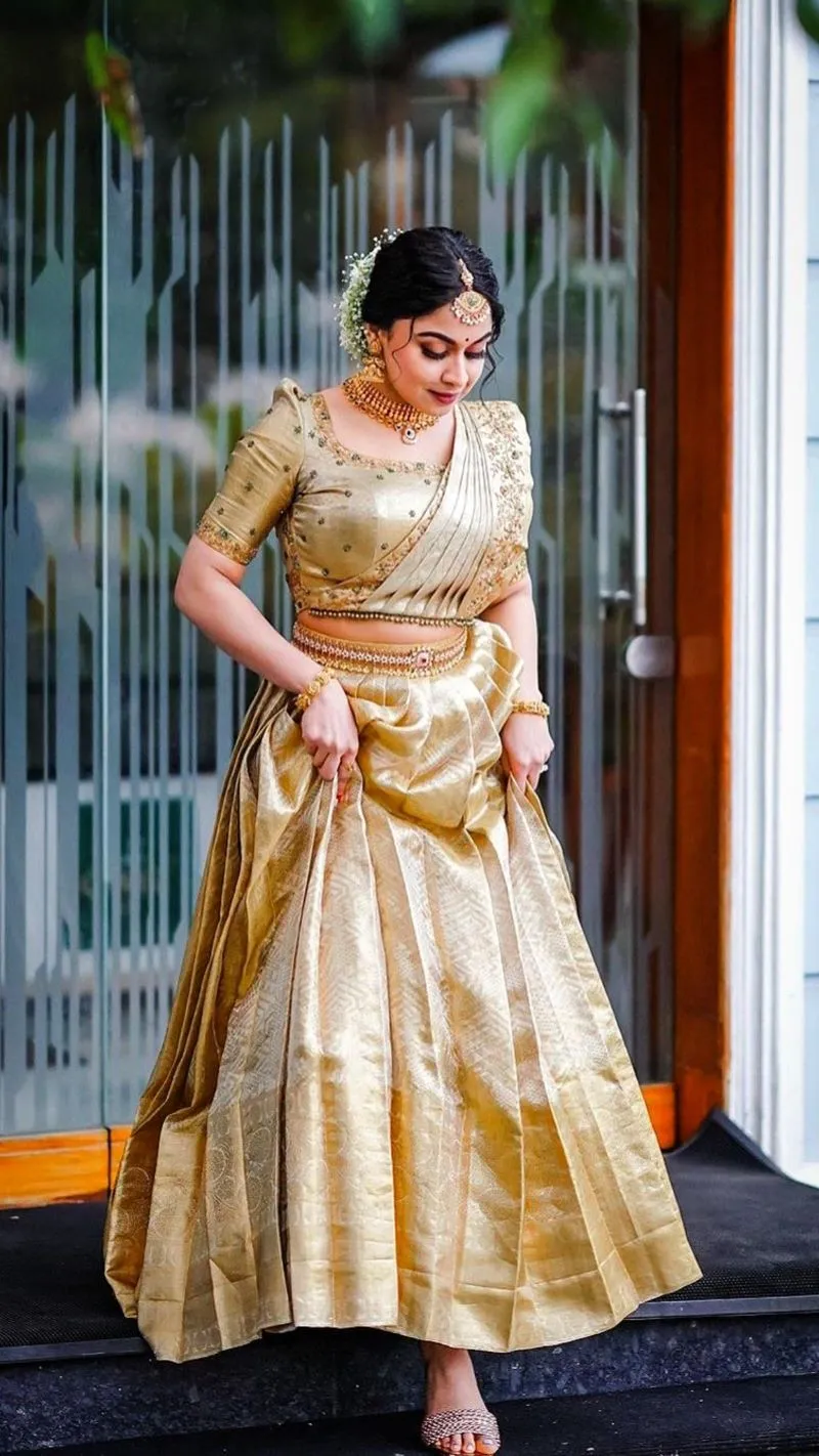 kerala bridal look simple in golden half saree lehenga