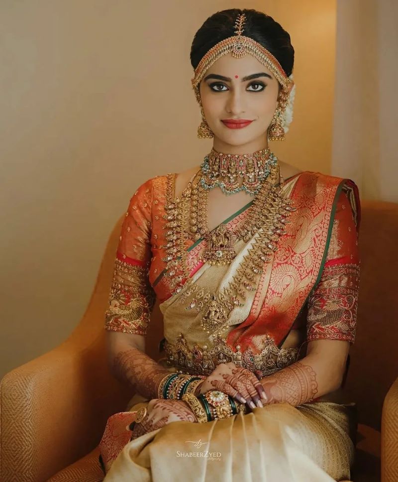 latest modern kerala bridal look in golden red saree