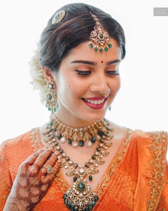 latest modern kerala bridal look in orange saree