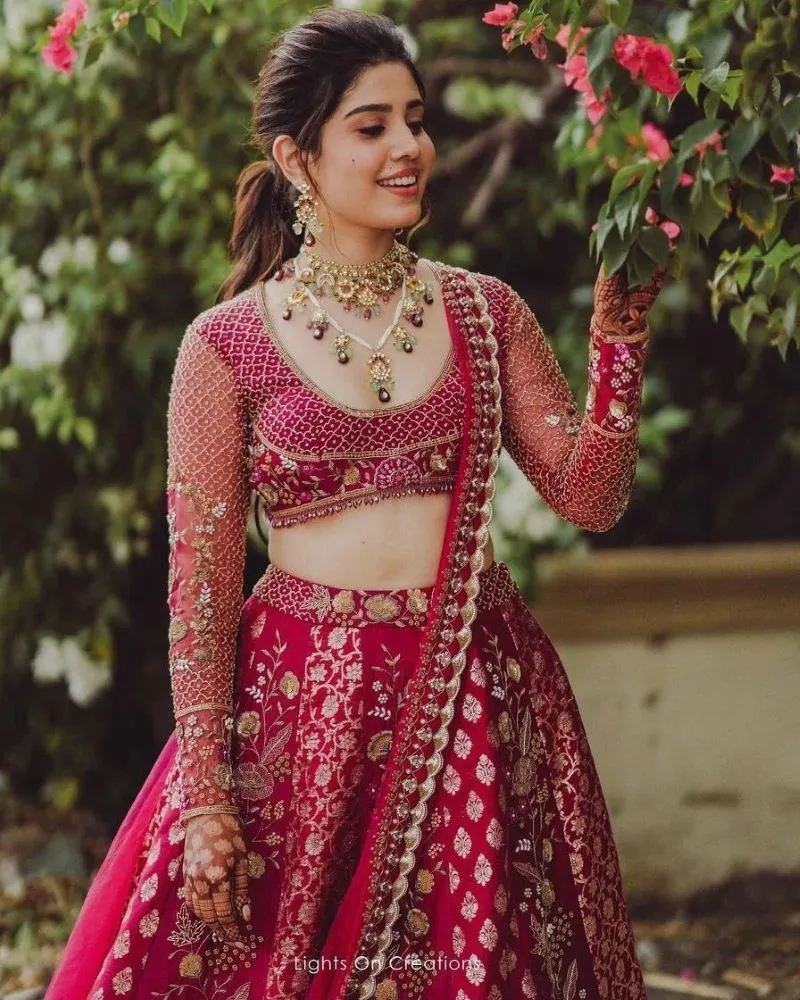 modern kerala bride in red and pink lehenga on her engagement