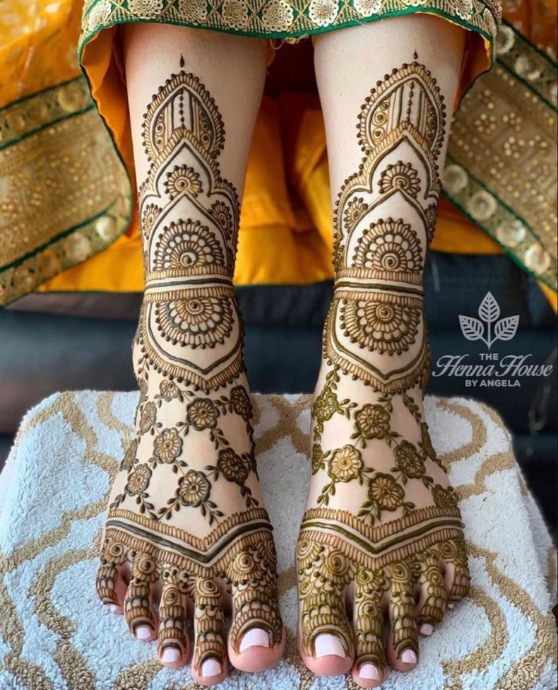 feet mehndi design with rose flowers and swirling motifs