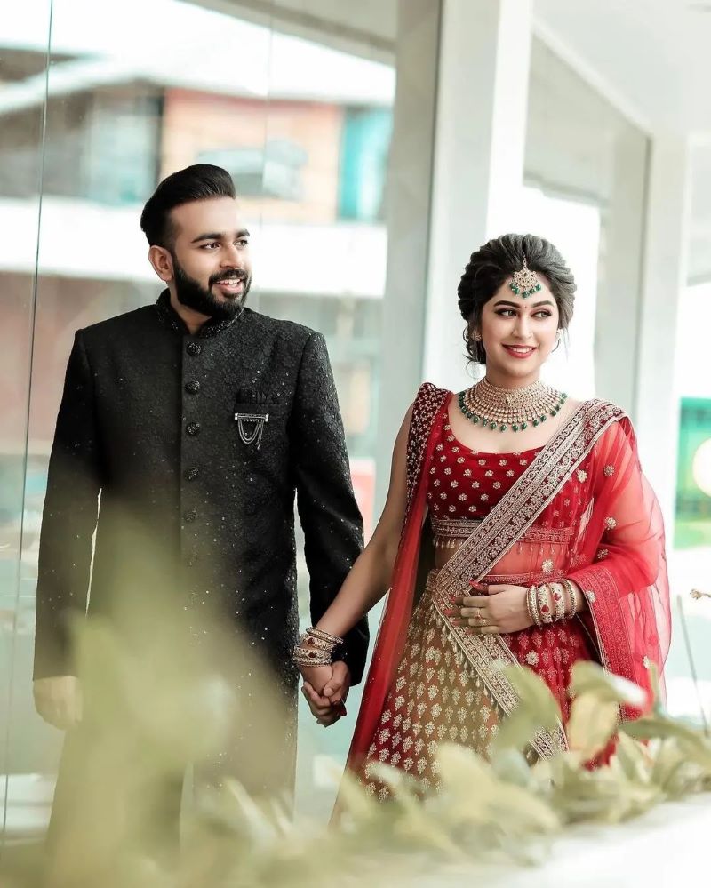 modern kerala bride in wine red lehenga on her reception