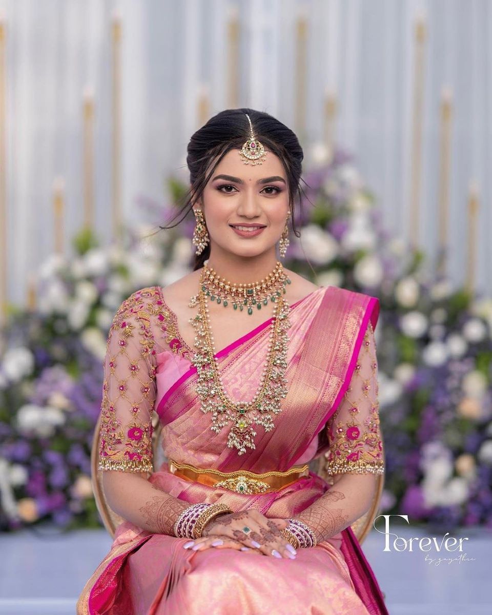 simple and trending south indian bridal makeup with pink saree