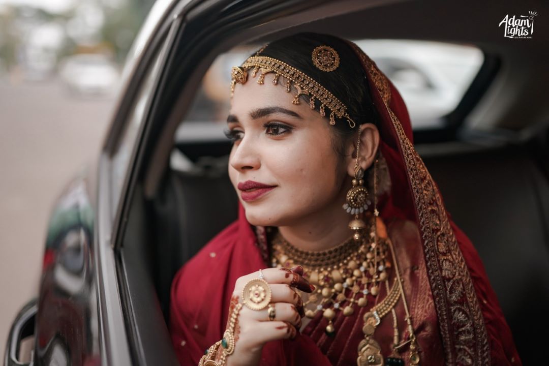 muslim kerala bridal look in red saree with matching dupatta on head