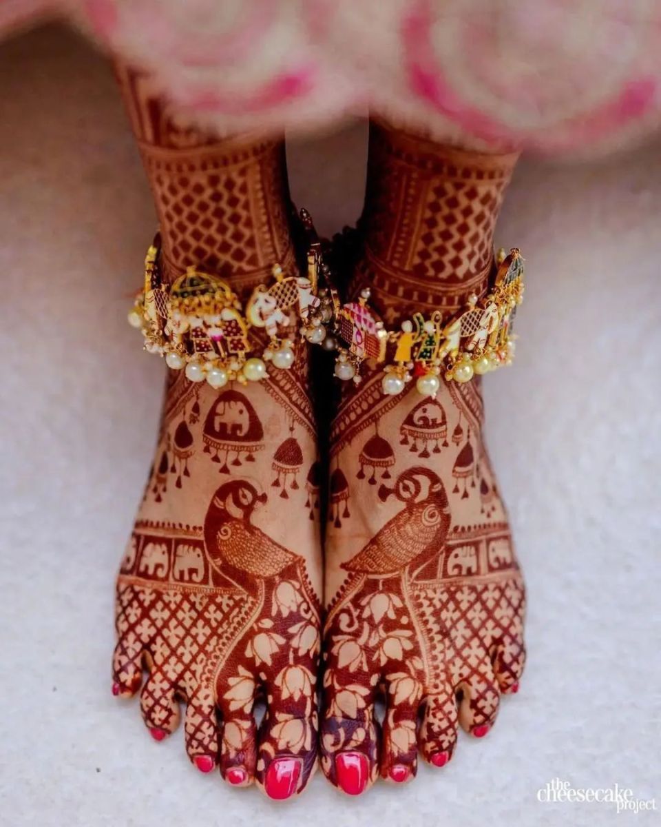 royal and modern foot mehndi design with peacock and lotus motifs