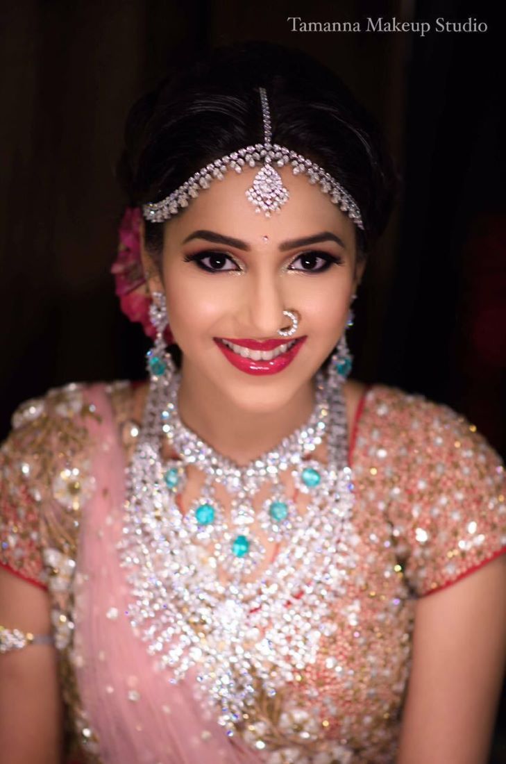 photo of south indian bridal makeup with glittery eyes and glossy lips