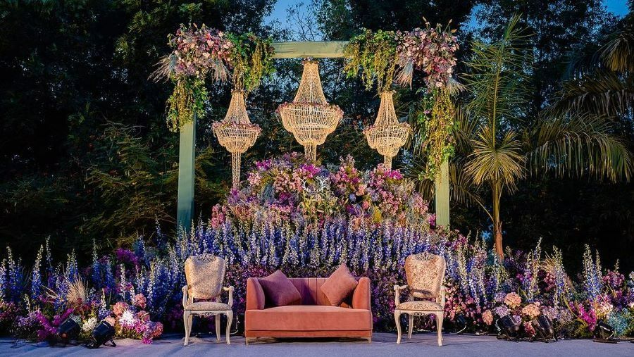 engagement stage decoration with pink and purple flowers