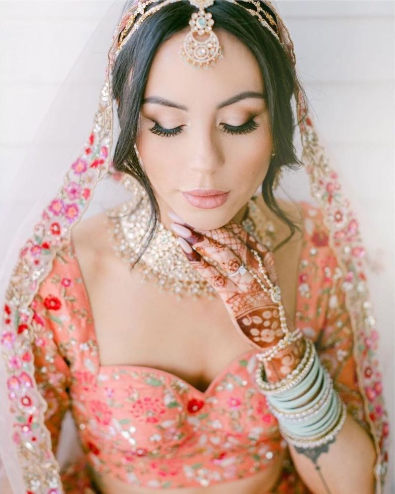 punjabi bride wearing beautiful pastel blue chura set