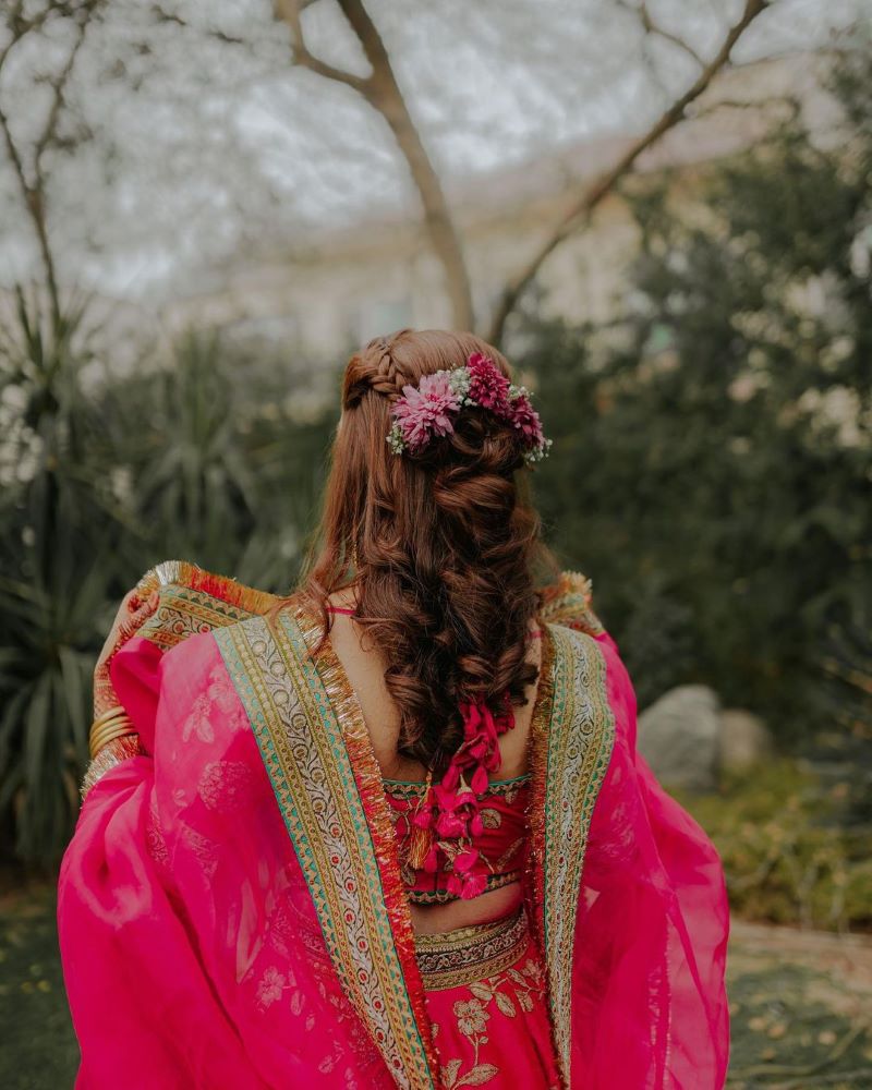 pakistani wedding hairstyles for shor hair with half tied curls and flowers