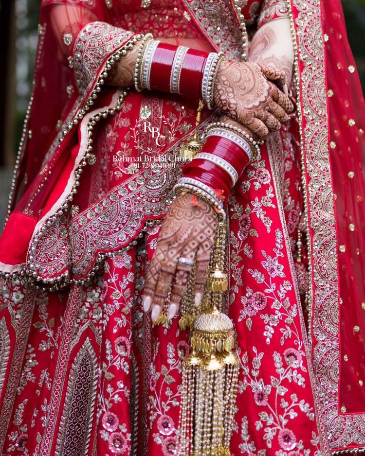 dark red punjabi bridal chura design with pearls