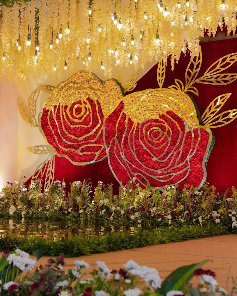 red and yellow rose backdrop for engagement or ring ceremony