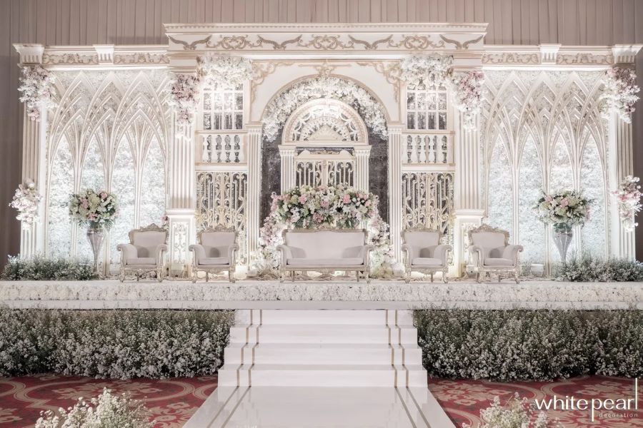 whimsical and magical white decor for wedding stage
